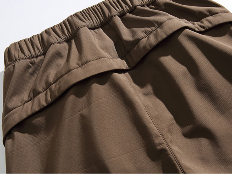 Men's 3-proof cargo pants with fleece lining - brown, back waistband close-up, for camping and outdoor work