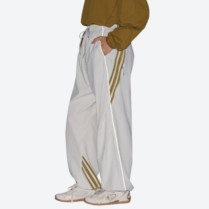 Unisex waterproof softshell cargo hiking pants - white pants with gold stripes and mustard top, for trail and mountain walks