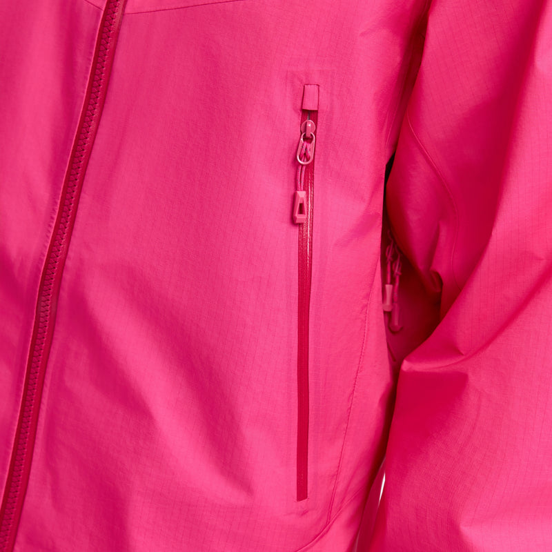 Women's breathable 3-layer storm shell jacket - pink, chest zip close-up detail, for resort and backcountry days