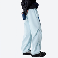 
                  
                    Unisex detachable liner insulated pants for winter - ice blue down pants, side view, for winter commute and travel
                  
                
