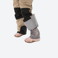 
                  
                    Kids breathable snowboard jacket and bib pants set - tan bib pants with black knee patches, snow gaiters keep snow out
                  
                