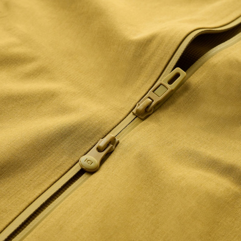Unisex seamless waterproof softshell jacket - mustard, zip puller close-up detail, for resort and street wear