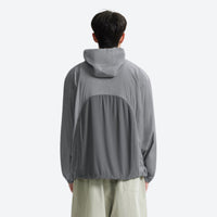 
                  
                    UPF100 featherlight hooded sun jacket - gray featherlight sun jacket on men, back standing view, for hiking and trail walking
                  
                