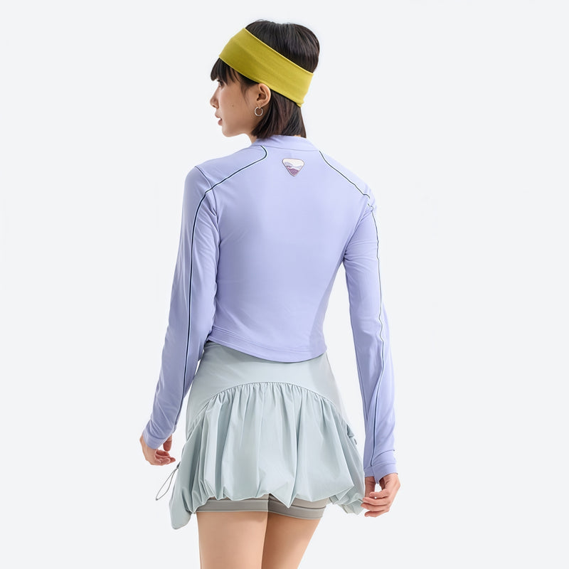 Women's stretchy fitted tee for outdoor - periwinkle half-zip long sleeve tee on women with headband, back standing view