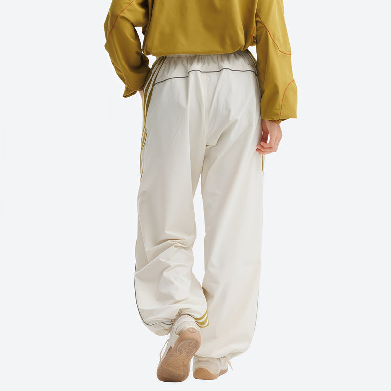 Unisex waterproof softshell cargo hiking pants - white pants with gold stripes and mustard top, for hiking and trekking