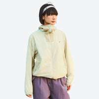 
                  
                    Packable hooded sun jacket for outdoor - cream yellow sun jacket on women with headband, for travel and city walks
                  
                