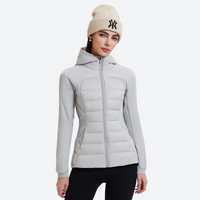 
                  
                    Women's lightweight goose-filled mid-layer jacket - light gray down jacket on women with beanie, for layering in cold weather
                  
                
