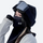 Black ski facemask neck gaiter for snow sports - black facemask on women in black cap with goggles, for winter mountain trips