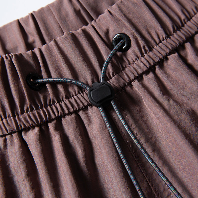 Breathable lightweight trail shorts - coffee brown, waist drawcord close-up, for travel and city walks