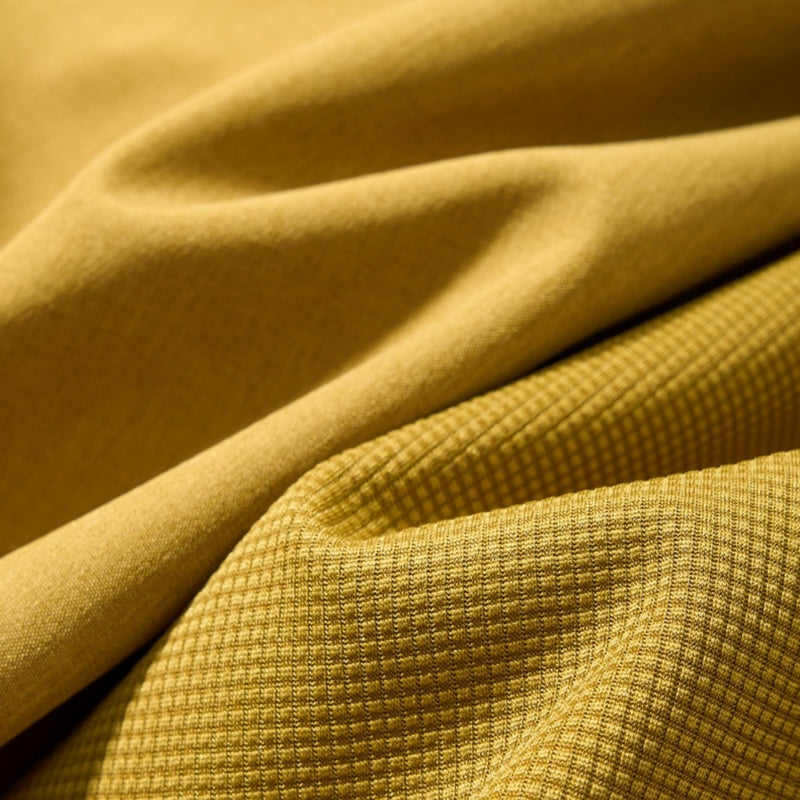Unisex seamless waterproof softshell jacket - mustard, fabric texture close-up detail, for skiing and snowboarding