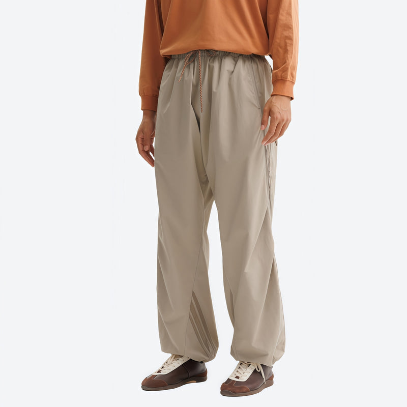 Breathable water-repellent trekking pants with vents - tan pants with orange top, for trail and mountain walks