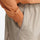 Unisex lightweight outdoor cargo pants - tan, waist pocket close-up with hand, for camping and travel