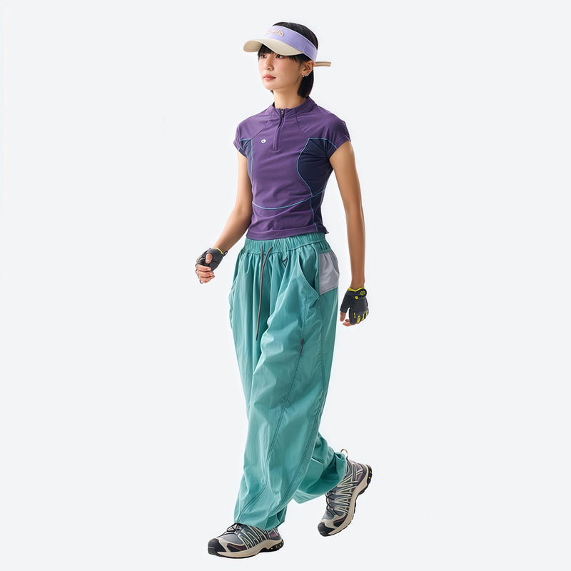 Unisex parachute hiking pants with hidden pockets - teal hiking pants with purple tee, for travel and camping