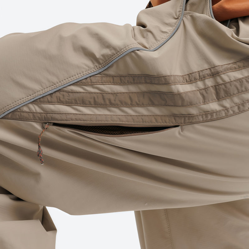 Unisex waterproof softshell cargo hiking pants - tan, thigh zip vent open close-up detail, for outdoor spring and autumn wear