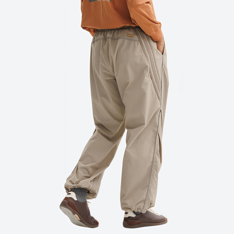 Breathable water-repellent trekking pants with vents - tan pants with orange top, for hiking and trekking
