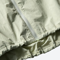 
                  
                    Water-repellent breathable sun jacket with hood - cream yellow sun jacket, hem zip close-up, for travel and city walks
                  
                
