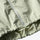 Water-repellent breathable sun jacket with hood - cream yellow sun jacket, hem zip close-up, for travel and city walks