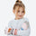 Kids' printed ski gloves with wrist strap - pink kids snow gloves on girl, hug wear view, for skiing and snowboarding