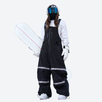 
                  
                    Unisex snowboard bib pants - black bib pants with white top, for cold-weather winter sports
                  
                