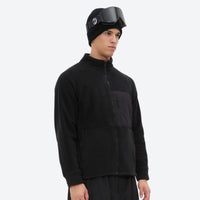 
                  
                    Soft warm fleece liner jacket for cold days - black fleece liner jacket on men with helmet, for skiing and snowboarding
                  
                