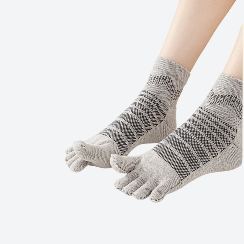 Merino wool toe socks for blister-free miles - gray five-toe merino wool socks on feet, for sandal and shoe pairing