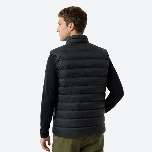 Warm water-repellent down layers for cold days - black down vest on men, back standing view, for camping and outdoor weekends