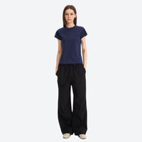 
                  
                    Water-repellent cargo hiking pants with drawcord hem - black wide-leg cargo pants with navy tee
                  
                