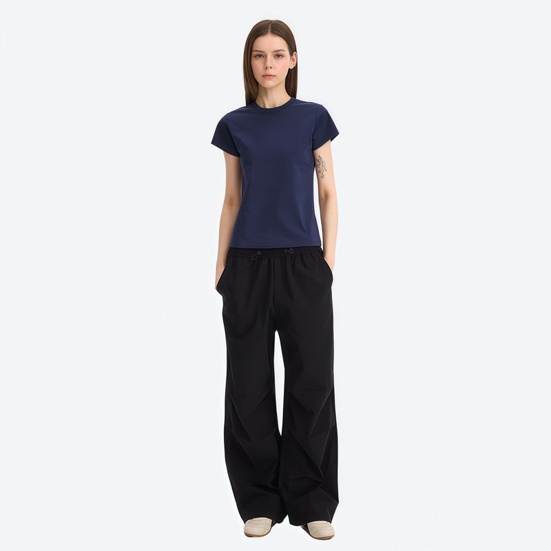 Water-repellent cargo hiking pants with drawcord hem - black wide-leg cargo pants with navy tee
