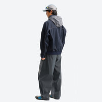 
                  
                    Unisex lightweight softshell outdoor pants - navy softshell jacket with gray pants, on-model side view, for hiking and travel
                  
                