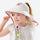 Bubble kids sun hat UPF50 with detachable neck flap - white kids sun hat with pink trim on girl, for travel and city walks