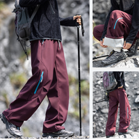 
                  
                    Water-repellent fleece hiking pants for cold days - plum fleece-lined hiking pants with black fleece top
                  
                