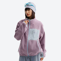
                  
                    Wrinkle-resistant heat-lock fleece jacket with full zip - lavender wavy fleece mid-layer jacket on women with beanie and gogg
                  
                