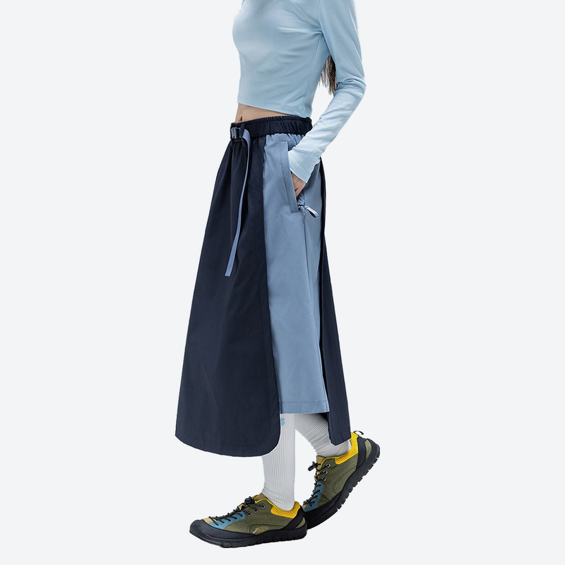 Versatile color-block water-repellent skirt - navy light blue color-block long skirt on women, side walking view