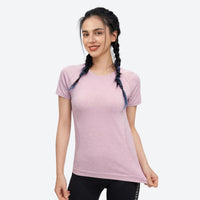 
                  
                    Soft merino wool baselayer with temperature control - pink merino wool baselayer tee on women, front standing view
                  
                