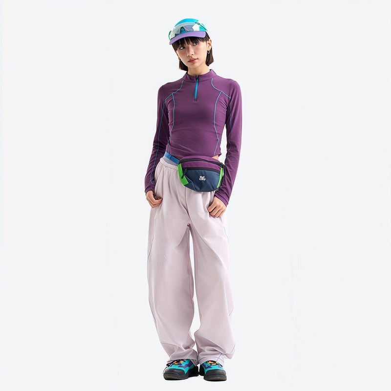 Women's stretchy fitted tee for outdoor - purple half-zip long sleeve tee on women with cap, front view with waist pouch