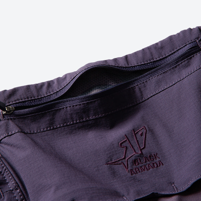 Unisex lightweight softshell outdoor pants - purple, waistband zip and label close-up detail, for skiing and snowboarding
