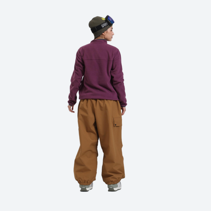 3-layer snowboard cargo pants - tan snow pants with purple pullover, on-model back view, for skiing and snowboarding
