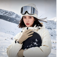 
                  
                    Cocoon merino wool thermal gloves with suede palm - beige merino wool thermal gloves on women holding snowboard
                  
                