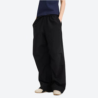
                  
                    Unisex UPF50 water-repellent cargo pants - black wide-leg cargo pants with navy tee, for sunny-weather trekking
                  
                
