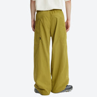 
                  
                    Unisex Cordura lightweight tear-resistant quick-dry pants - olive wide-leg pants with white tee, for warm-weather trekking
                  
                