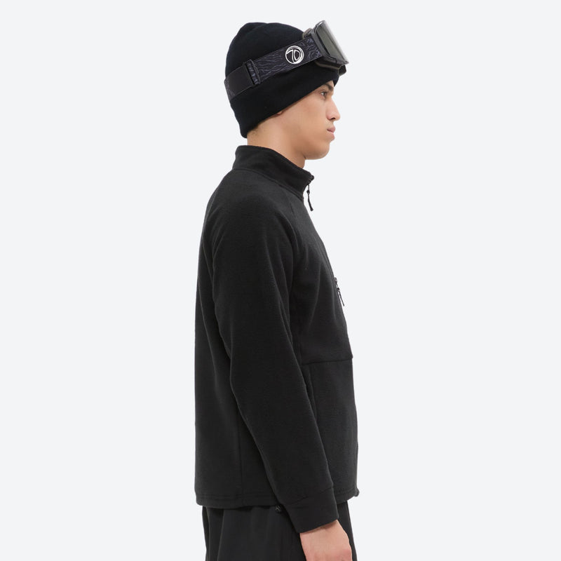 Lightweight high-warmth breathable fleece liner jacket - black fleece liner jacket on men with beanie, side standing view