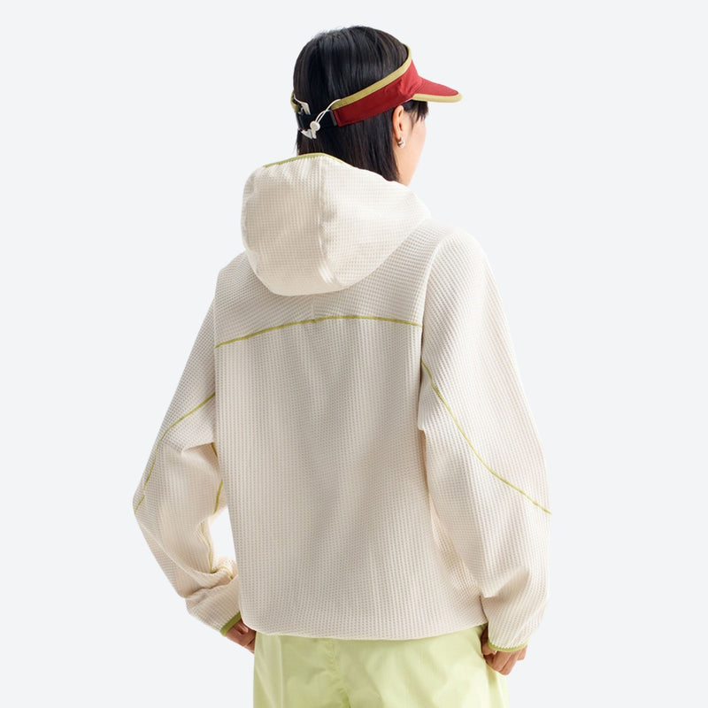 Breathable comfort mid-layer hoodie - cream hooded mid-layer pullover on women with visor, for layering in cool weather
