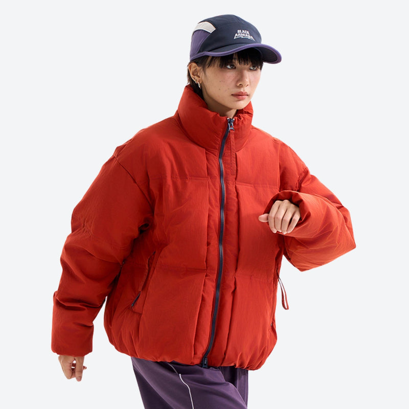 Windproof stand-collar puffy down jacket - red windproof stand-collar down jacket on women with cap, front view with arm bent