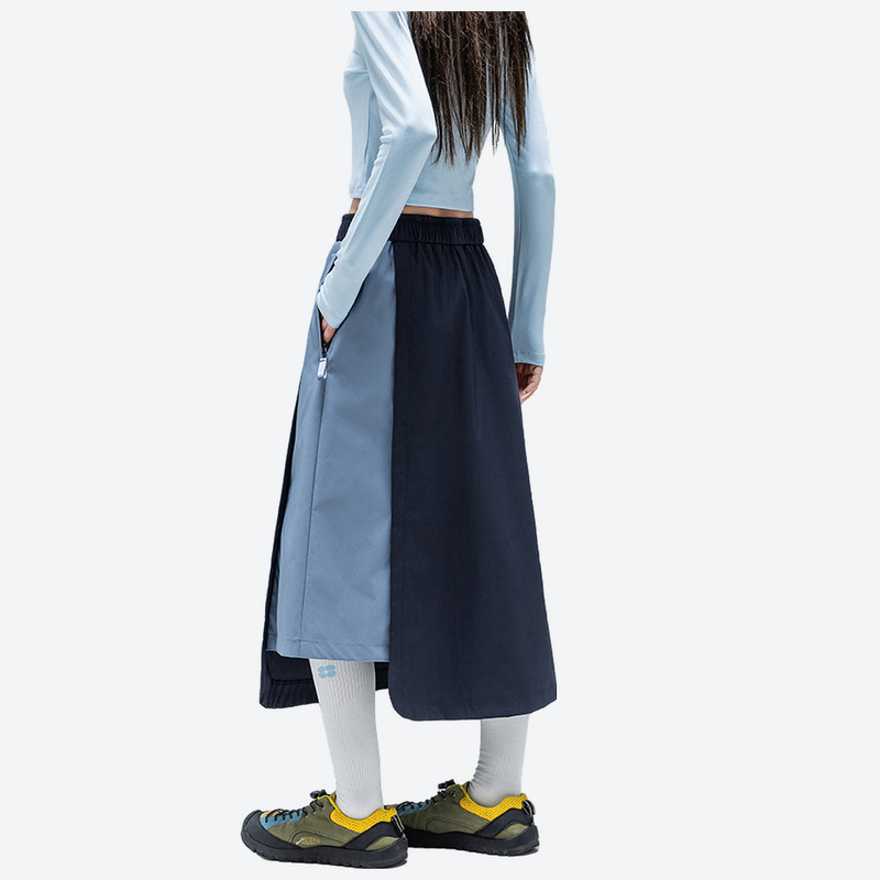 Water-repellent color-block long skirt PFOS PFOA free - navy light blue color-block long skirt on women, side standing view