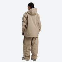 
                  
                    Women's 2-layer snowboard jacket and pants - tan jacket with tan pants, for powder days and winter commute
                  
                
