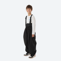 
                  
                    Youth 3-layer ski suit with bib pants - black bib pants, kids on-model side view, for family resort ski days
                  
                