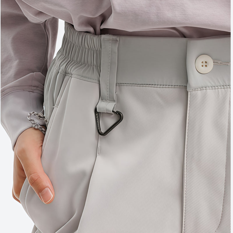 Breathable water-repellent camo softshell set - white, waistband ring close-up with hand, for skiing and snowboarding