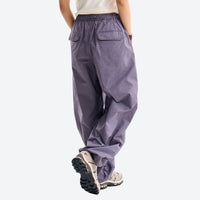 
                  
                    Unisex quick-dry water-repellent hiking pants - mauve purple quick-dry hiking pants with white tee, for warm-weather trekking
                  
                