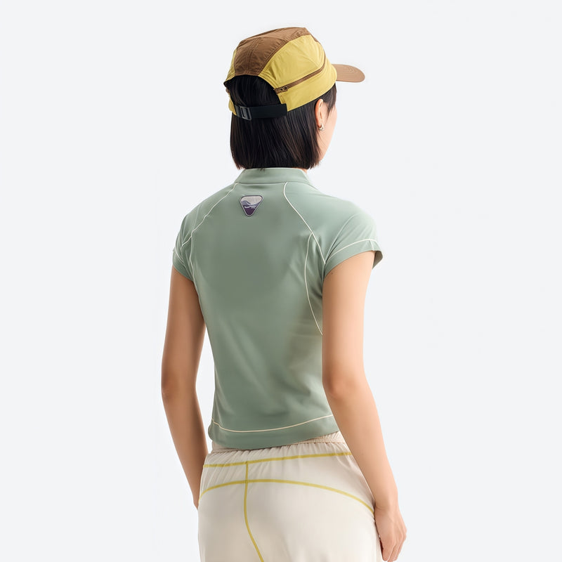 Women's wrinkle-resistant half-zip top - sage green half-zip short sleeve tee on women with cap, for travel and city walks