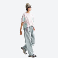 
                  
                    Breathable relaxed trail pants with drawcord waist - light blue quick-dry hiking pants with white tee
                  
                